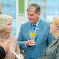 Two alumni and president T-Haas and his wife, Marcia Haas, enjoy conversation together at the Reunion Dinner.
